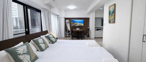 Appartement, 2 lits doubles | Rideaux dâobscurcissement, fer et planche Ă repasser