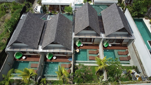 A multi-story resort with rooftop pools and outdoor seating areas. - Arena Villa Ubud (Ubud)