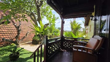 Deluxe Suite, Pool View | Desk, laptop workspace, free WiFi