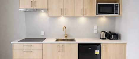 Mini-fridge, microwave, stovetop, cookware/dishes/utensils