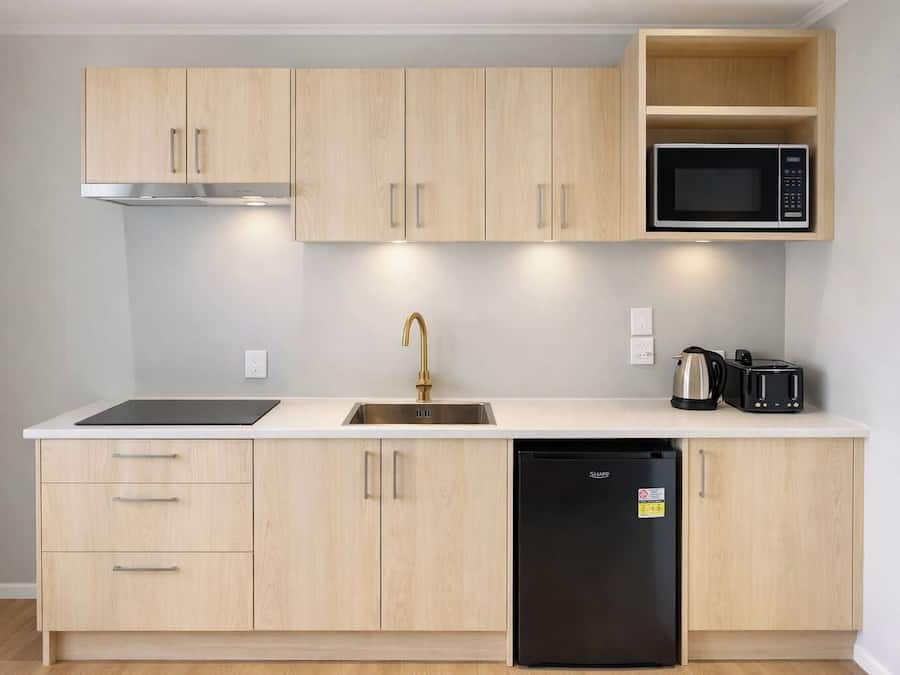 Mini-fridge, microwave, stovetop, cookware/dishes/utensils