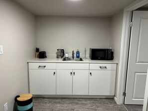 Fridge, microwave, coffee/tea maker, toaster