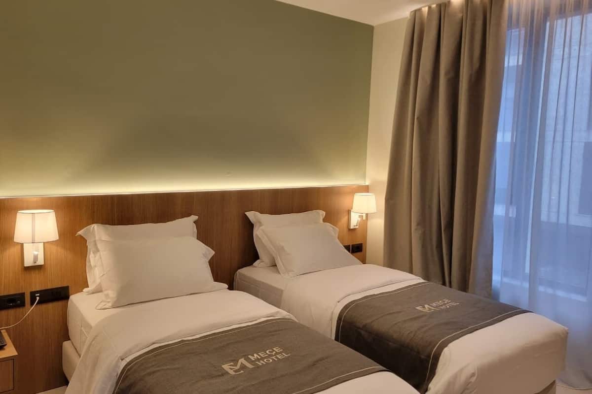 Double or Twin Room | Minibar, in-room safe, desk, blackout drapes