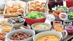 A buffet with various dishes including salads, pasta, and baked goods. - Aurum Misawa (Misawa)