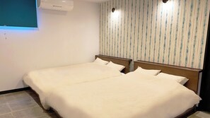 A hotel room with two beds, a window with blinds, a wall-mounted air conditioner, and a striped wallpaper design. - Marinx Poolvilla Nakandakari (Nanjo)