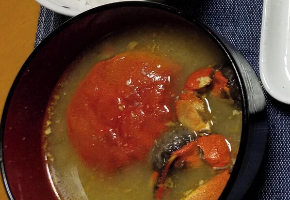 A bowl of soup with a red sauce and a crab. - Yamadera Kosen Second House Ikoi (Kanoya)