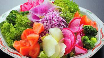 A colorful vegetable salad with various types of vegetables.