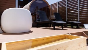 A wooden deck with a white bench and two lounge chairs. - Shipponomori Resort Awajishima Sauna & Studio (Awaji)
