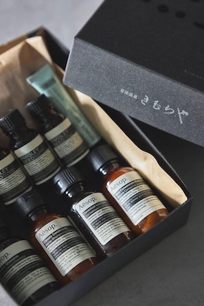 A black box containing several bottles of Aesop products. - Kusatsu Onsen Kimuraya (Kusatsu)