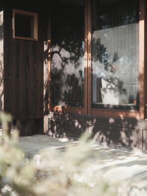 A wooden exterior with a window and a door. - Manai7.stay (Izumo)
