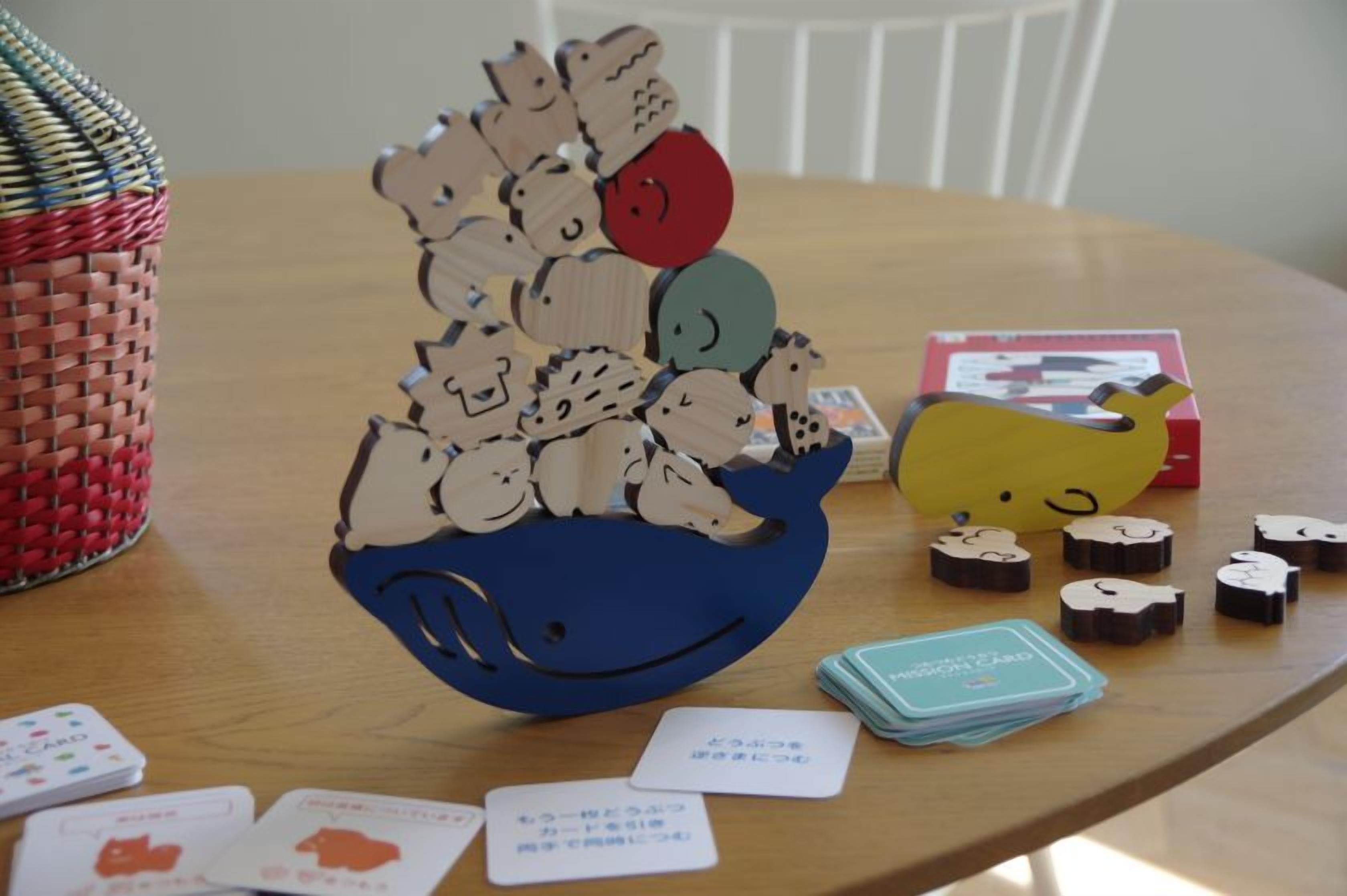 A wooden puzzle game with various animal pieces on a table.