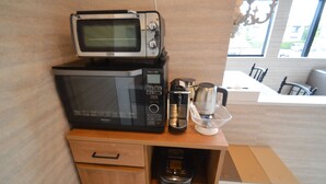 A kitchenette with a microwave, coffee maker, and a small oven. - Enico. Mt. Fuji Peace (Fujikawaguchiko)