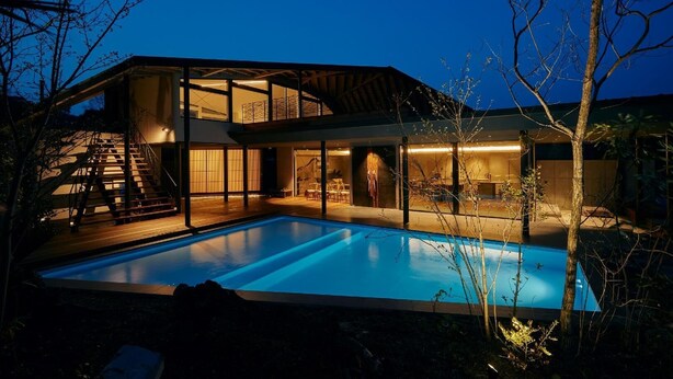 A modern two-story house with a swimming pool, large windows, and a staircase leading to the upper level. - Tsumunagi Kitaken Building (Mitoyo)