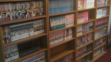 A library with bookshelves filled with books.