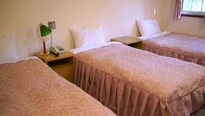 A hotel room with two single beds, a bedside table with a lamp, a phone, and a window with curtains. - Winds (Tateshina)