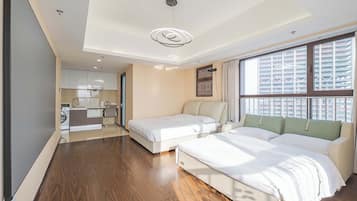 Family Room, City View | Desk, soundproofing, free WiFi, bed sheets