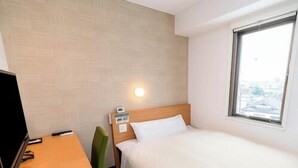 A hotel room with a bed, a desk, a chair, a TV, and a window. - Super Hotel Saitama Kuki (Kuki)