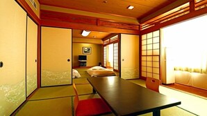 A traditional Japanese-style room with tatami flooring, a low table, and sliding doors. - Tochigi Grand Hotel (Tochigi)