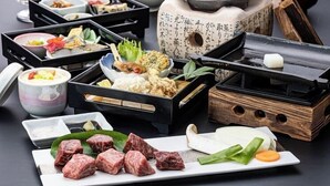 A variety of Japanese dishes and food items displayed in black and white ceramic containers. - Niimi Chiya Onsen Ibuki no Sato (Niimi)