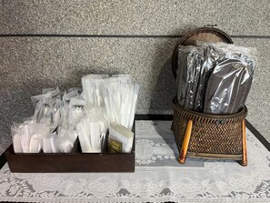 A display of toiletries in a hotel setting, including toothbrushes, toothpaste, and other personal care items. - Hotel Tetora Kasugai Station Hotel (Kasugai)