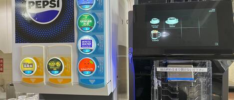 A vending machine with various drink options including Pepsi, ginger ale, and coffee.