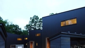 A modern building with multiple entry points and a gravel courtyard. - Co-ya-do Nasu (Nasu)