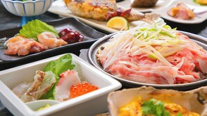 A variety of dishes including sashimi, grilled fish, and a bowl of shredded vegetables. - Business Hotel Wayokan/annex Wako (Inazawa)