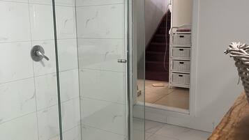 Shower, towels, soap, toilet paper