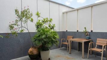 Luxury Triple Room, City View | Outdoor dining