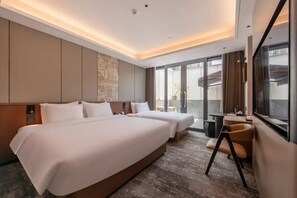 Family Triple Room, City View | Desk, laptop workspace, free WiFi