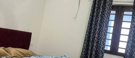 Habitación Deluxe | Camas extra, wifi gratis y ropa de cama