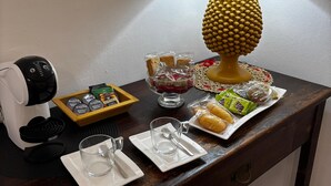 A wooden table with a coffee maker, a lamp, and various food items. - Etna Docet, Nicolosi center (Nicolosi)