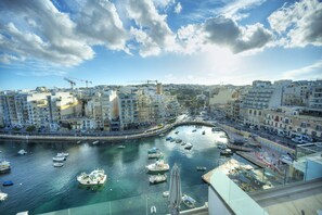 A harbor with boats, buildings, and a clear sky. - Luxury seaview penthouse,roof terrace,hot tub YVAN1-1 (St Julian's)