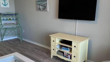 Signature Condo, 1 Bedroom, Balcony, Beach View | Living room | 32-inch Smart TV with digital channels