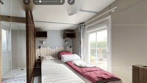 Un dormitorio moderno con una cama grande, un cabecero de madera y vistas al exterior a través de una puerta corredera.