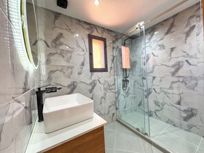 Shower, towels, soap, toilet paper