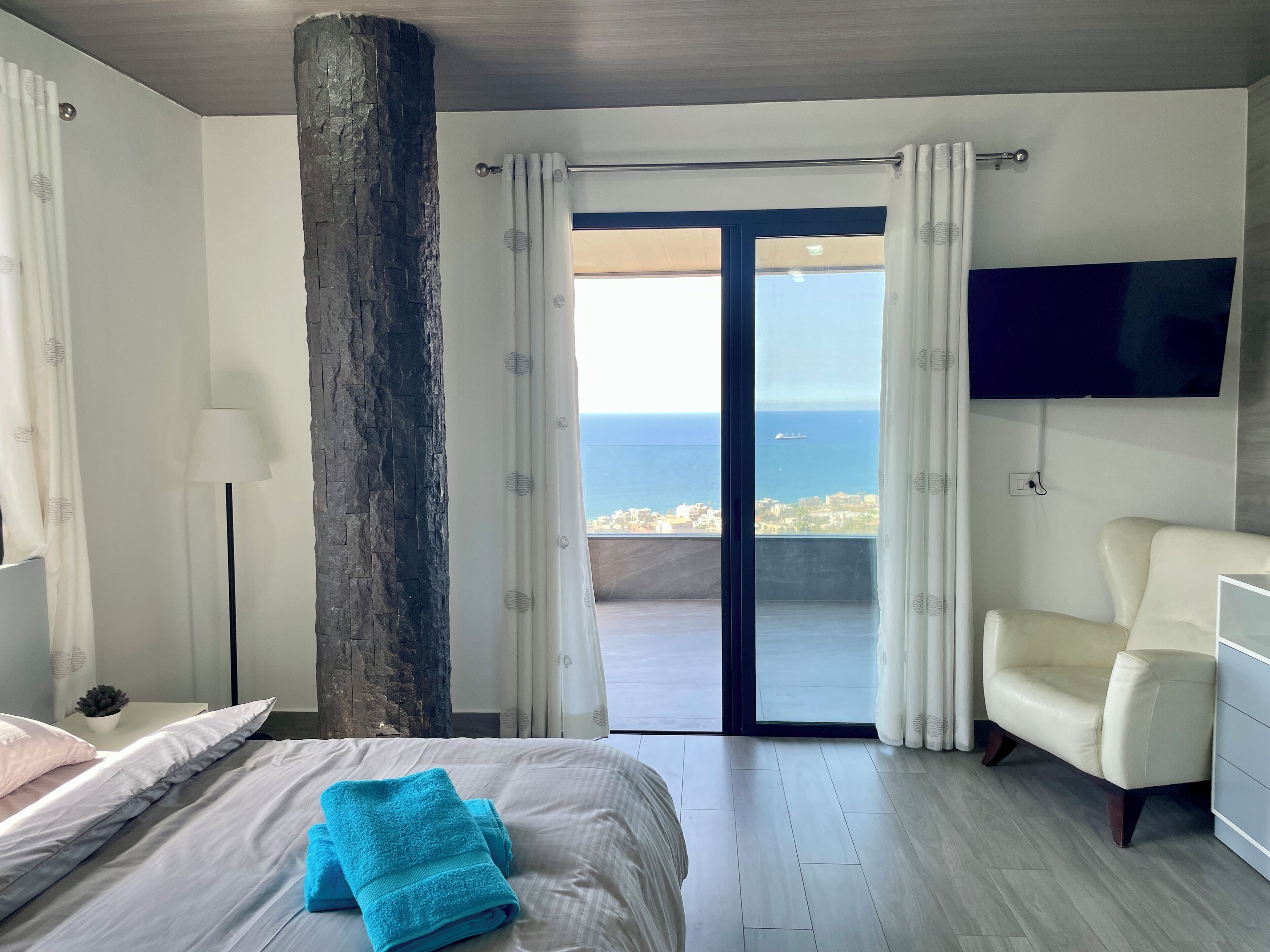 Deluxe Apartment, Sea View | Desk, laptop workspace, blackout curtains, iron/ironing board