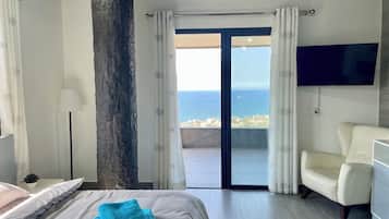 Deluxe Apartment, Sea View | Desk, laptop workspace, blackout curtains, iron/ironing board