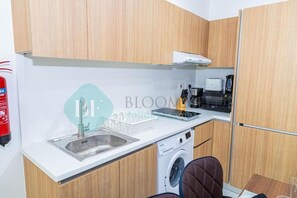 Apartamento, sacada | Cozinha privada