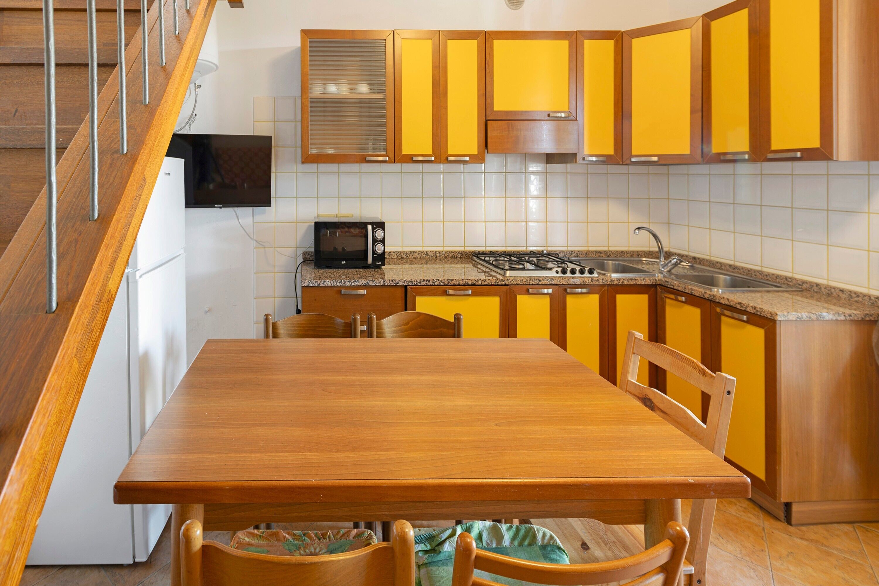 Fridge, microwave, stovetop, cookware/dishes/utensils