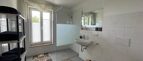 Shower, hair dryer, towels, soap
