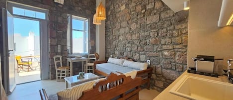 Petra Split-Level Apartment | Living area | 43-inch flat-screen TV with cable channels