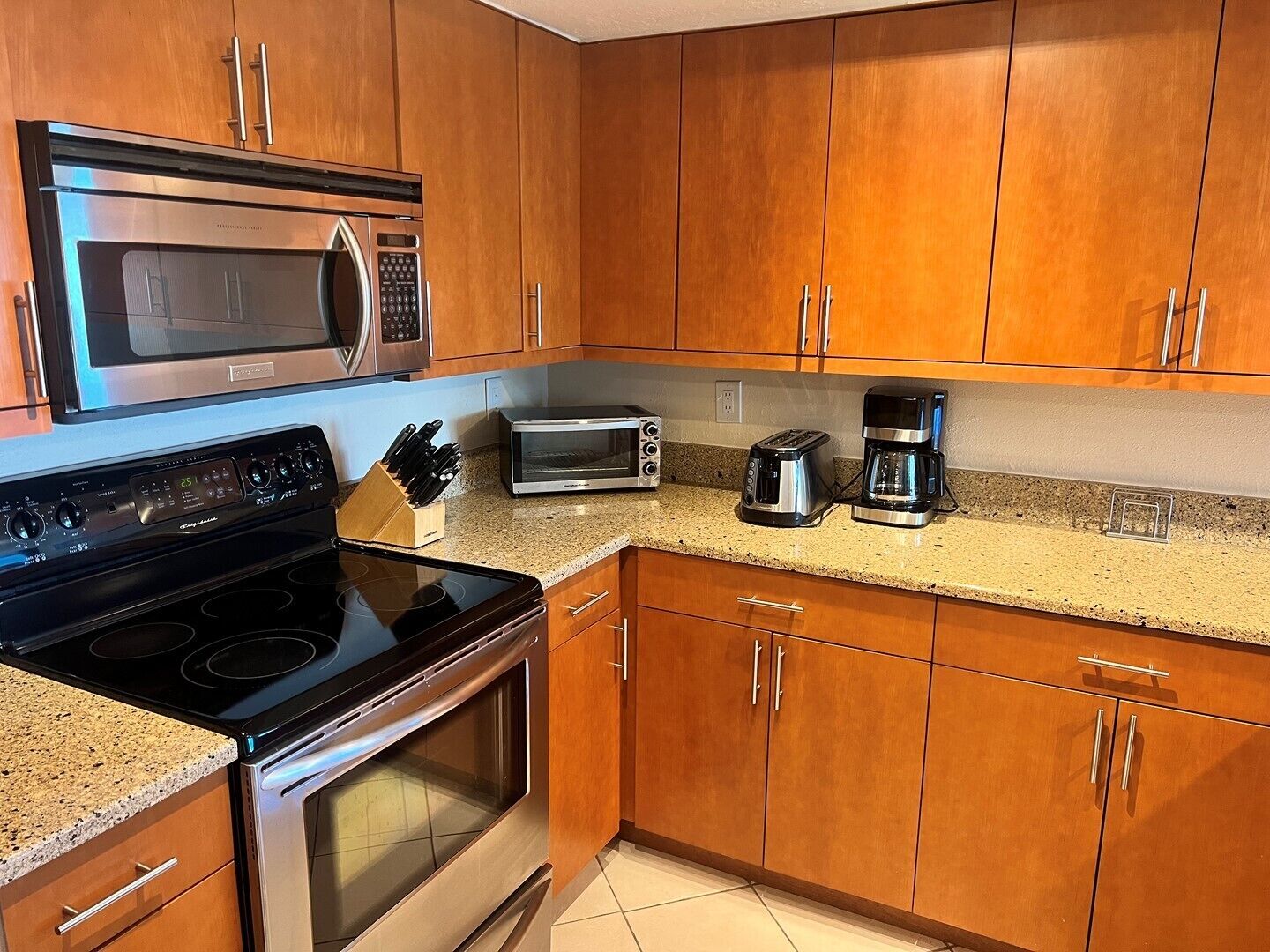 Oven, dishwasher, coffee/tea maker, cookware/dishes/utensils