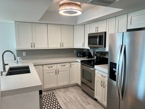Oven, dishwasher, coffee/tea maker, cookware/dishes/utensils - Siesta Sands 611 | Beach Days & Sunset Nights (Sarasota)