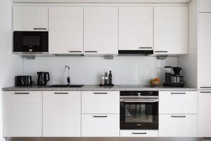 Fridge, microwave, oven, stovetop - By Tripla & Train Station | King Bed · 55 TV · Gym (Helsinki)