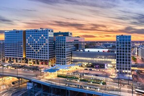 A modern urban area with high-rise buildings, a central plaza, and a bridge. - Sauna, balcony, wifi, trainstation, Mall of Tripla (Helsinki)