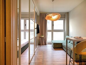 Apartamento Deluxe, vistas a la ciudad | Zona de estar