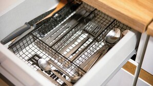 A kitchen drawer with utensils and cookware. - Urban Stay by Timisoara BnB Ap 2 (Timisoara)