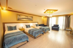 Deluxe Triple Room | In-room safe, desk, blackout curtains, soundproofing