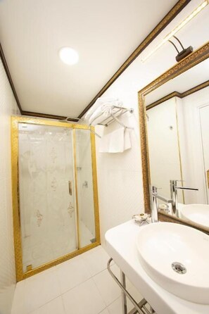 Shower, free toiletries, hair dryer, slippers